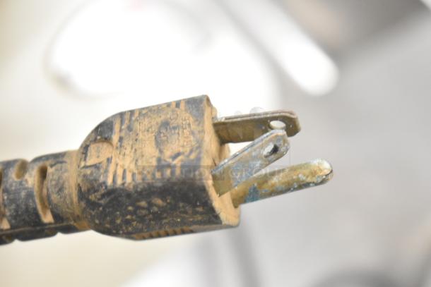 Globe 260 meat slicer plug, showing corrosion and wear, indicating its electrical use condition.