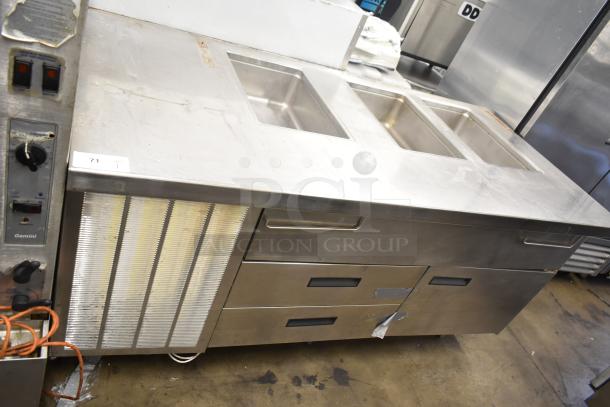 Commercial prep station with three wells, two drawers, one door. Operates at 115 volts, 1 phase. Used condition.