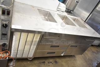 Commercial prep station with three wells, two drawers, one door. Operates at 115 volts, 1 phase. Used condition.