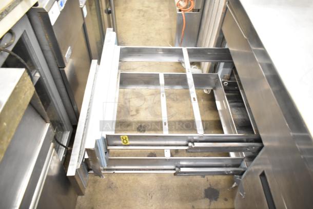 Commercial prep station with 3 wells, 2 drawers, 1 door, and metal construction. 115 volts, 1 phase. Good condition.