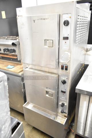 Cleveland Gemini commercial 2 deck steam cabinet, stainless steel, dual control knobs, fair condition with visible wear.