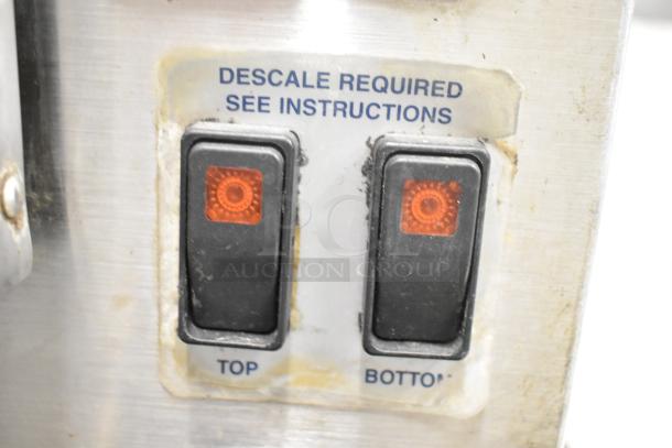 Cleveland Gemini Commercial 2 Deck Steam Cabinet, requiring descaling, dual toggle switches for top and bottom.