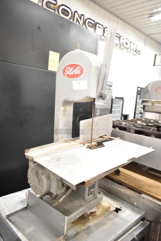 Globe 79 commercial countertop meat saw, 115 volts, 1 phase, visible wear, Globe logo on motor housing.