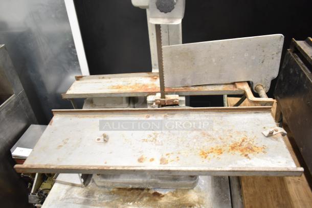 Globe 79 Commercial Countertop Meat Saw, 115 volts, 1 phase. Shows signs of rust and wear.