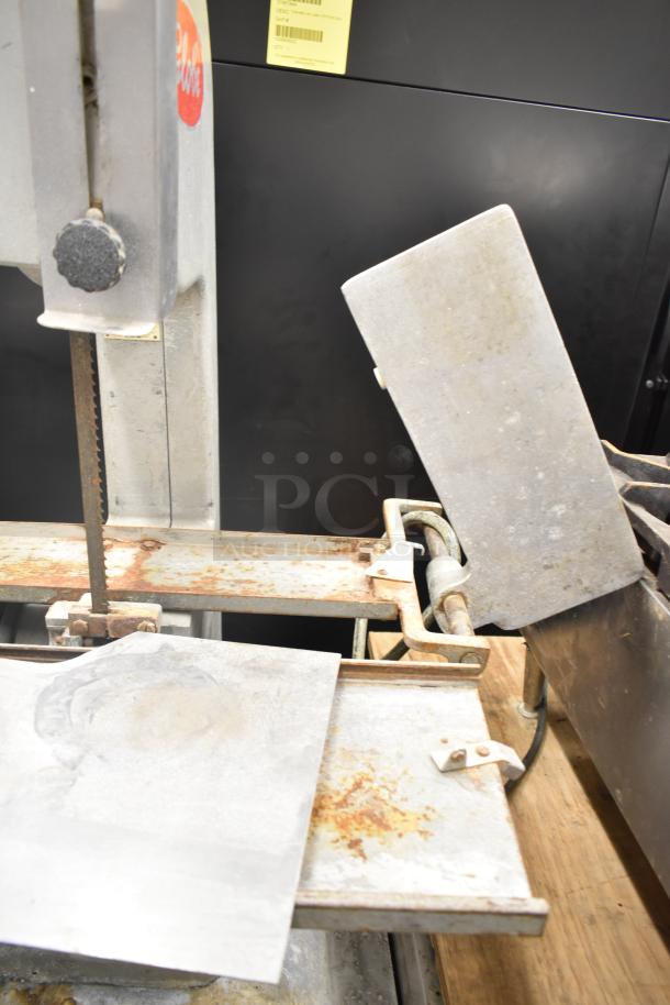 Globe 79 Commercial Countertop Meat Saw, 115 Volts, 1 Phase, visible wear, rust on metal surfaces, operational handles.