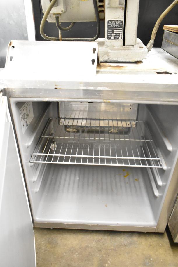 2022 Delfield 406CAP-DHL-DD1 undercounter cooler, single door, 115V, 1 phase, commercial-grade. Visible interior shelf.