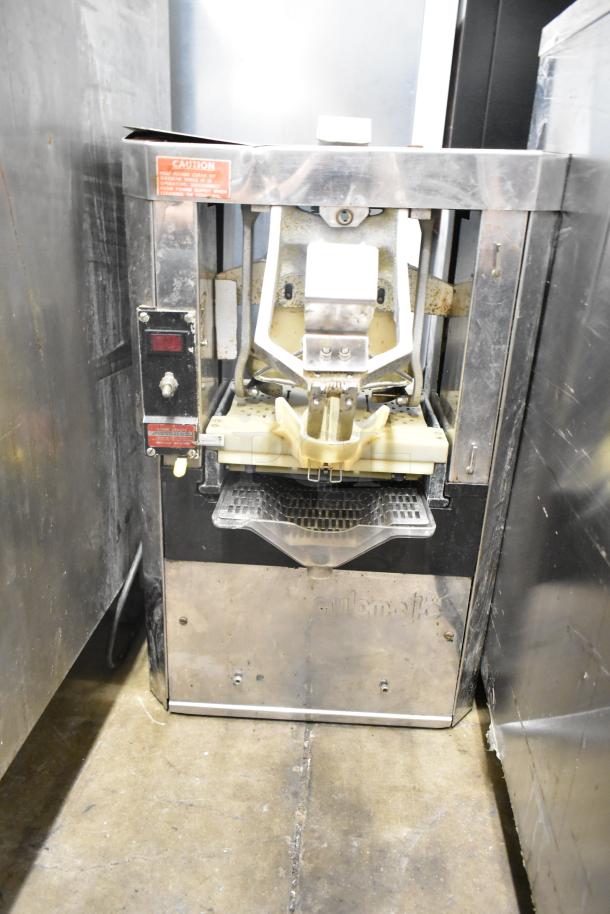 Automatic S-16 countertop citrus juicer, 115 volts, commercial use. Visible wear, stainless steel, model label intact.