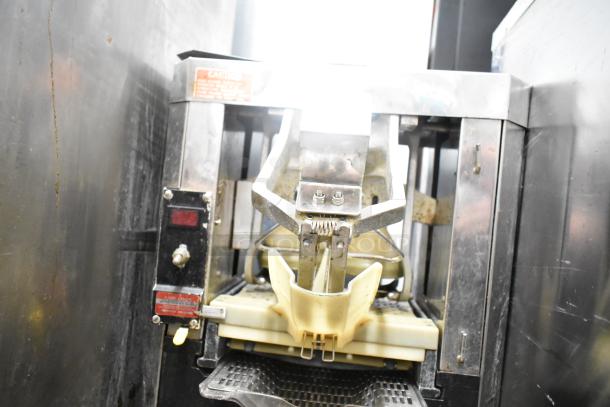 Automatic S-16 Commercial Countertop Citrus Juicer, 115V, 1 Phase. Features include durable metal frame, dispensing spout.