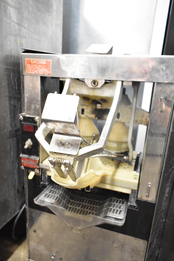 Automatic S-16 Commercial Citrus Juicer, 115 Volts, 1 Phase, visible wear, countertop model, features stainless steel parts.