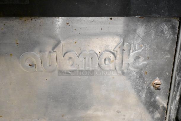 Automatic S-16 Commercial Citrus Juicer, stainless steel finish, visible brand markings, 115 Volts, used condition.