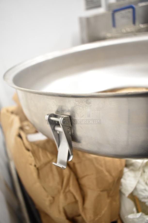 Metal pizza pan with a sturdy latch, part of a lot including 9 various items such as lightbulbs, auctioned at 9 times your bid.