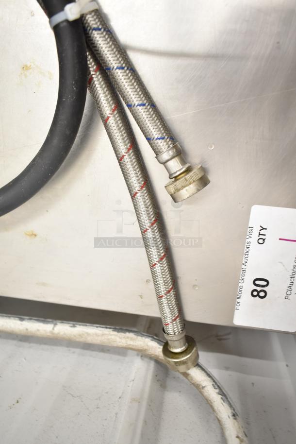 Stainless steel braided hoses connected to Blodgett BLCT6E electric combi oven. Auction tag with number 80 visible.