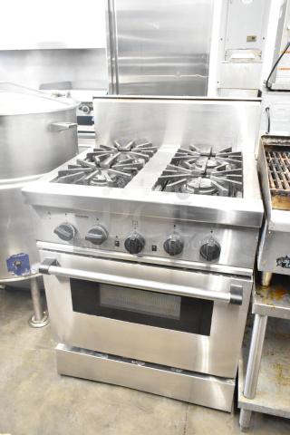 Thermador Professional 4 Burner Gas Range with Convection Oven, stainless steel, durable condition, visible control knobs.