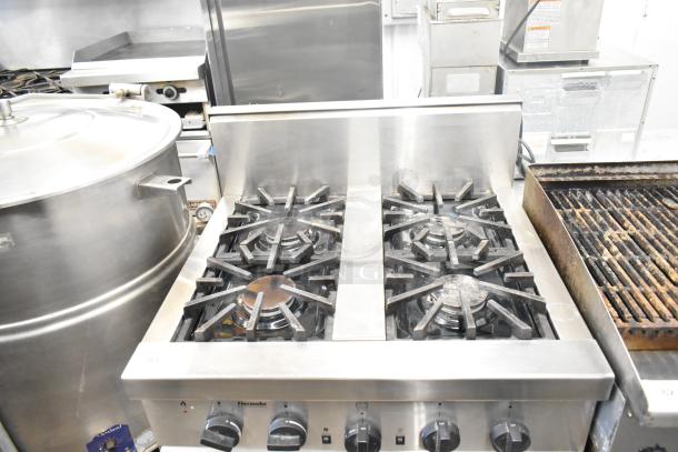 Thermador Professional 4-burner gas range with convection oven, stainless steel, used condition, visible dials and branding.