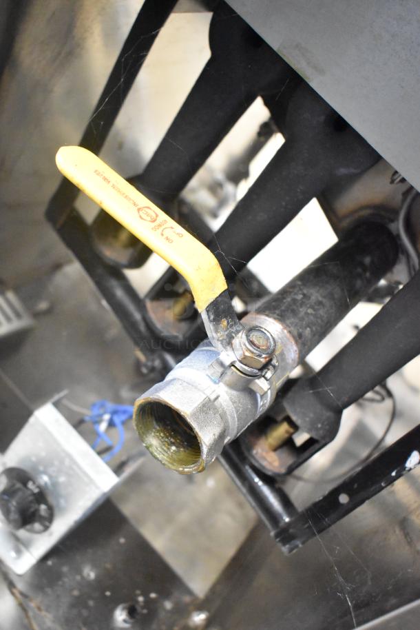 2022 Kutano KUT50FRN50SNG natural gas fryer. Features include a metal valve and yellow handle. Appears in used condition.