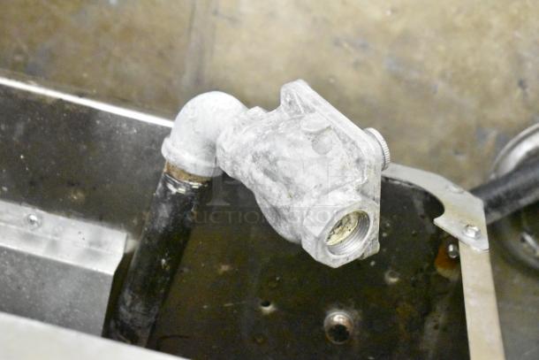 2022 Kutano KUT50FRN50SNG natural gas commercial deep fryer component, showing pipe fittings and metal casing.