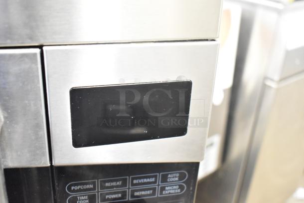 General Electric GE Profile PVM1790SR1SS microwave oven, stainless steel, with control panel buttons visible.