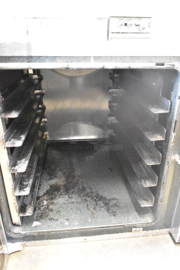 Moffat Turbofan E32D5 commercial convection oven, features seven tray capacity, visible wear, 208V, 1 phase.