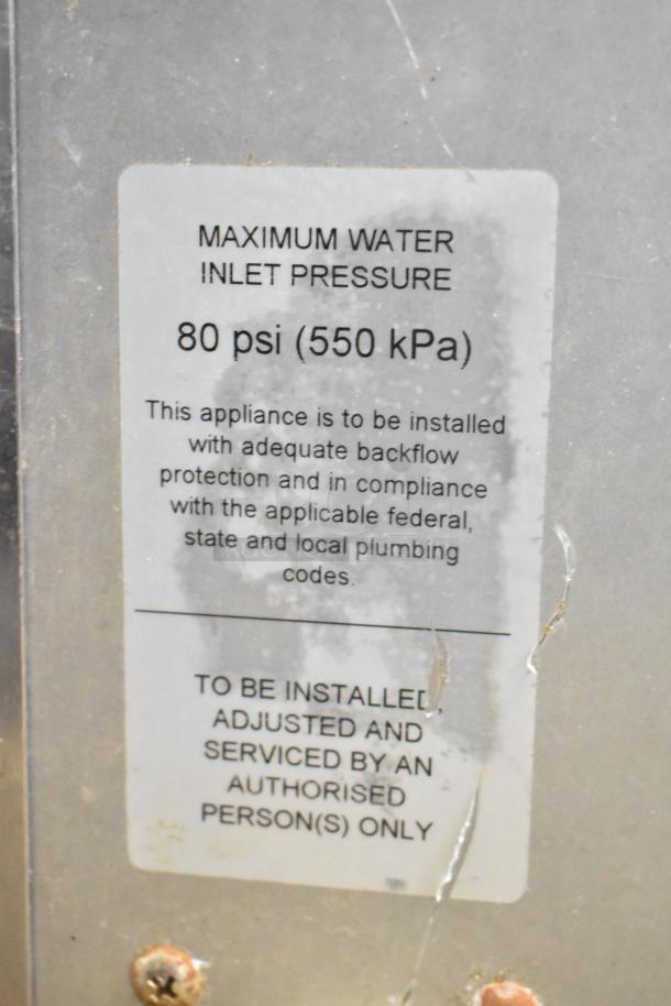 Moffat Turbofan E32D5 convection oven tag, indicating 80 psi max water pressure, installation by authorized personnel.