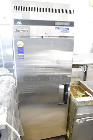 Everest ESF1 commercial single door reach-in freezer, stainless steel, 115 volts, 1 phase, warranty label visible.