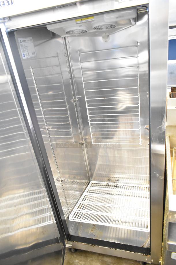 Everest ESF1 Commercial Single Door Reach In Freezer, 115V, 1 Phase, stainless steel, adjustable wire shelves, pre-owned condition.