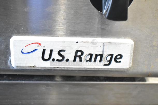 US Range Commercial Gas 8 Burner. Stainless steel body with brand logo, in good condition. Ideal for high-volume kitchens.