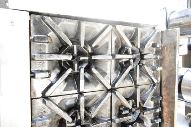 US Range Commercial 8 Burner Gas Range, countertop model. Features cast iron grates, used condition, wear visible on surfaces.