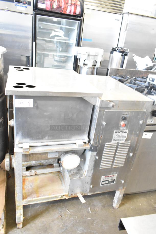 Hollymatic 180 commercial meat mixer grinder, floor style, visible wear and surface rust, model label intact.