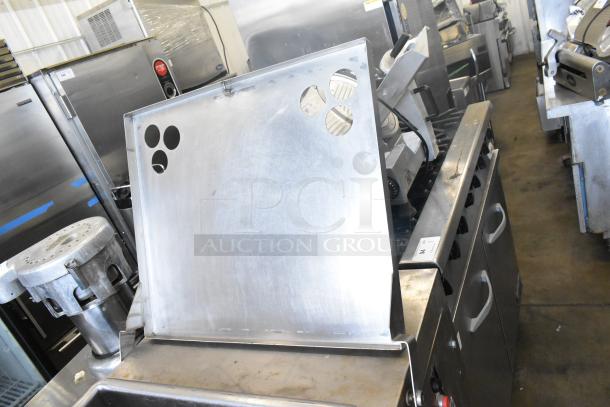 Hollymatic 180 Commercial Meat Mixer Grinder, stainless steel, floor style, visible wear, ideal for high-volume prepping.