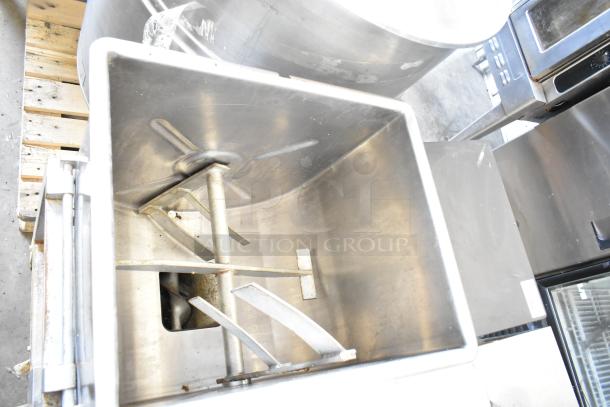 Hollymatic 180 commercial meat mixer grinder, stainless steel interior, industrial-grade condition, visible mixing blades.