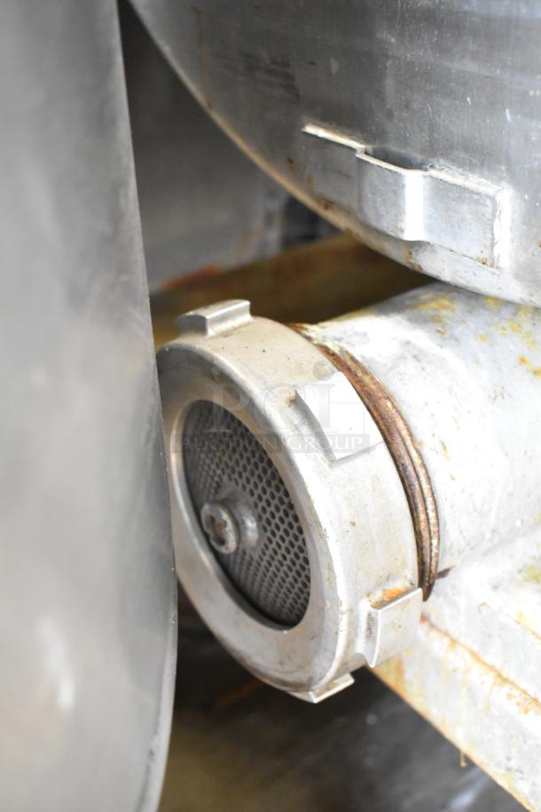 Hollymatic 180 commercial meat mixer grinder, metal exterior, visible wear and oxidation, model number plate attached.