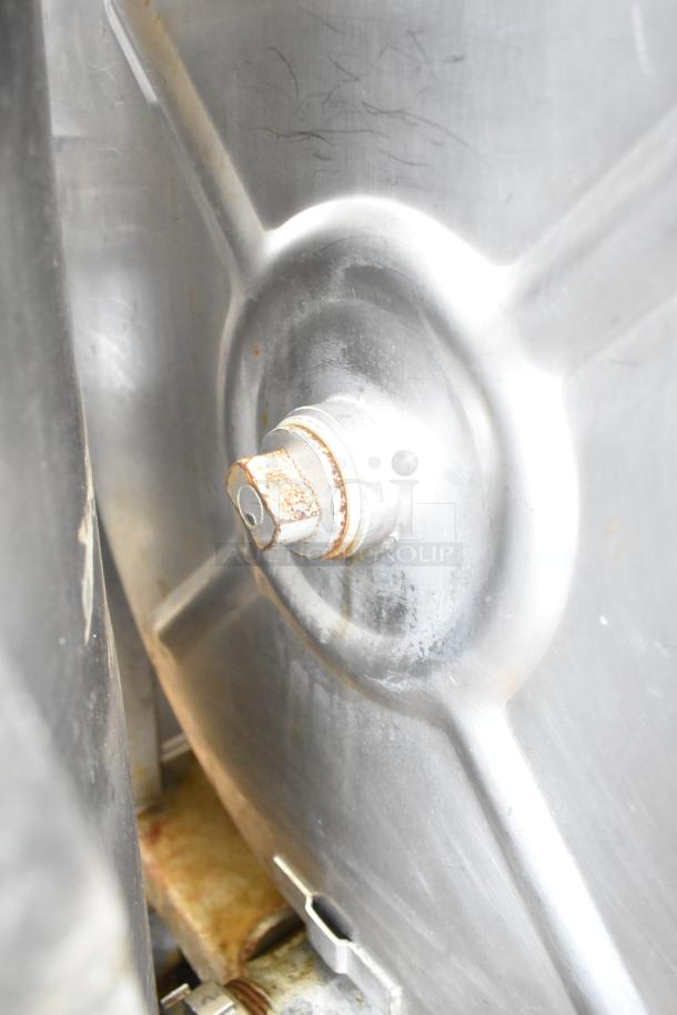 Hollymatic 180 commercial meat mixer grinder, stainless steel, visible wear, sturdy construction. Ideal for high-volume processing.