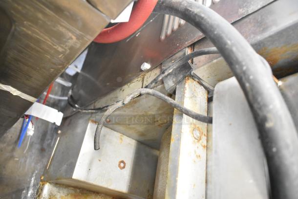 Hollymatic 180 meat mixer grinder, showing wiring and metal components. Some rust visible, indicating used condition.