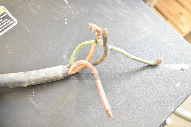 Frayed power cord of Hollymatic 180 Meat Mixer Grinder. Caution needed for repair or replacement for safe operation.