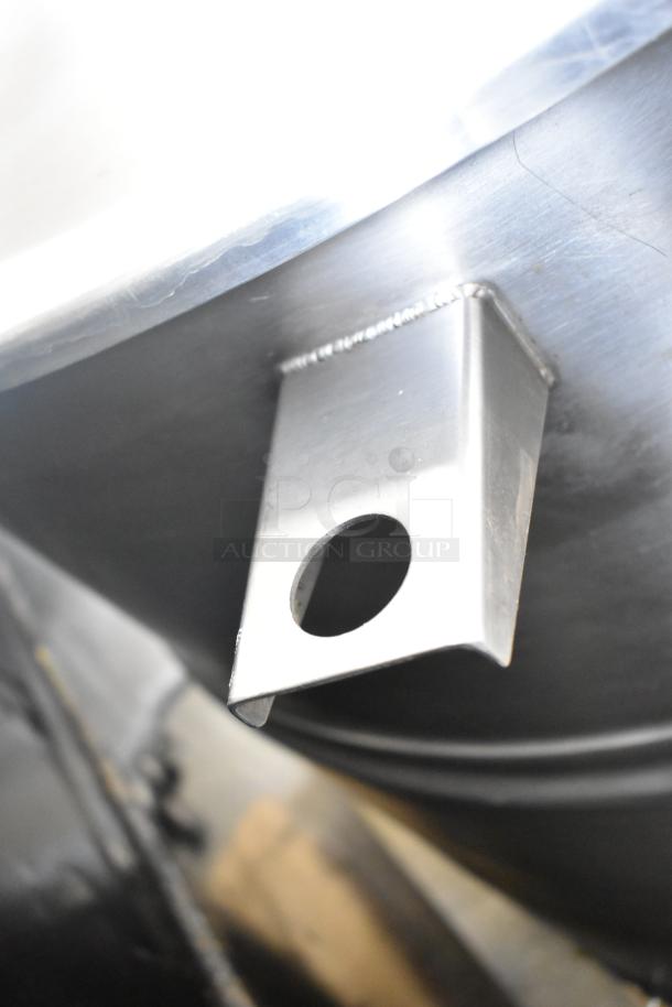 Cleveland KEL-100 100 Gallon Steam Jacketed Electric Kettle, stainless steel construction, obscure view of attachment detail.