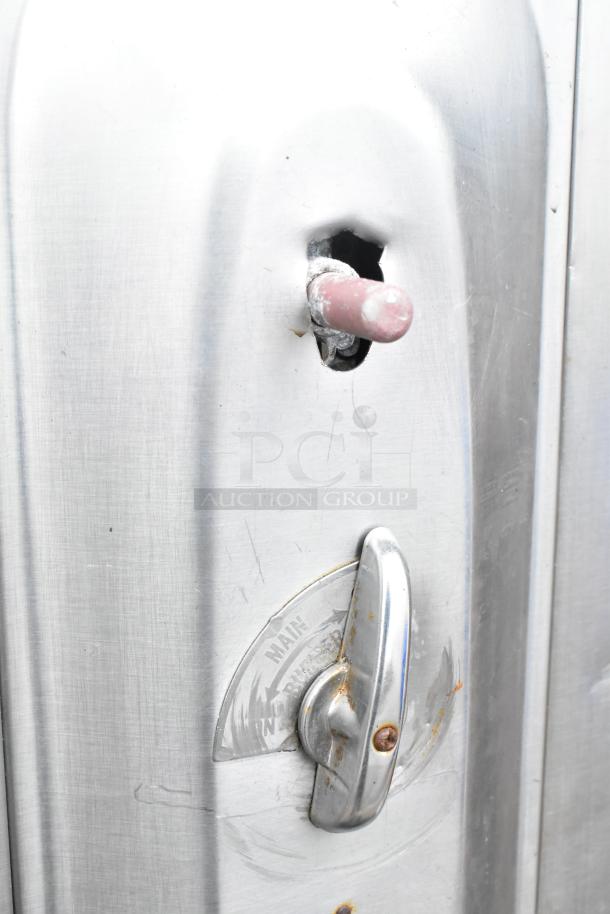 2 commercial gas-powered single burner pizza ovens with cooking stones; features a control knob and slight wear.