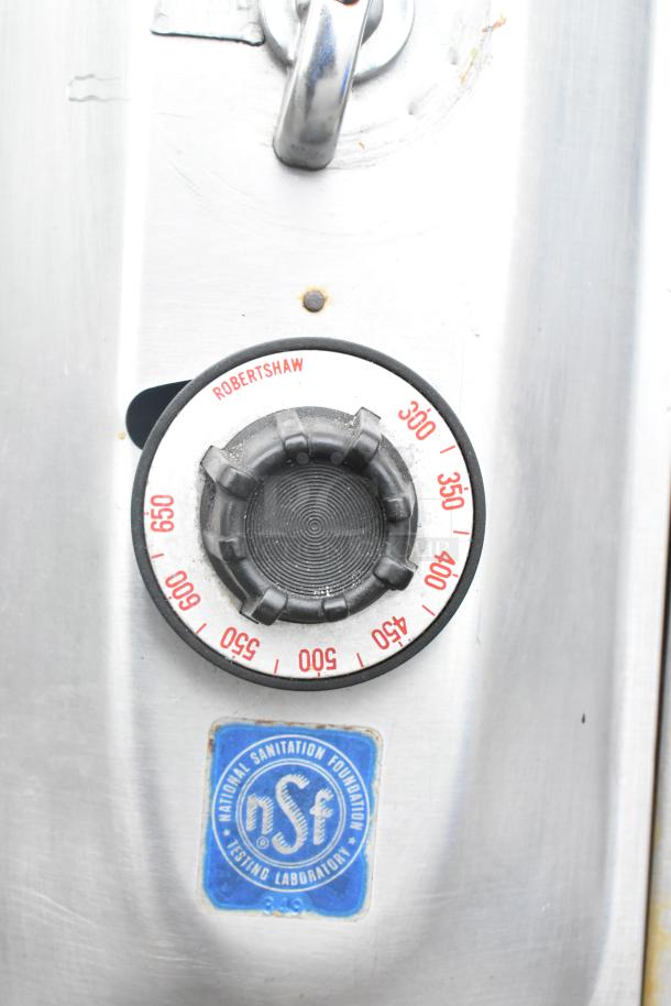 NSF-certified commercial gas pizza oven dial with Robertshaw brand label and temperature range from 300 to 650 degrees Fahrenheit.