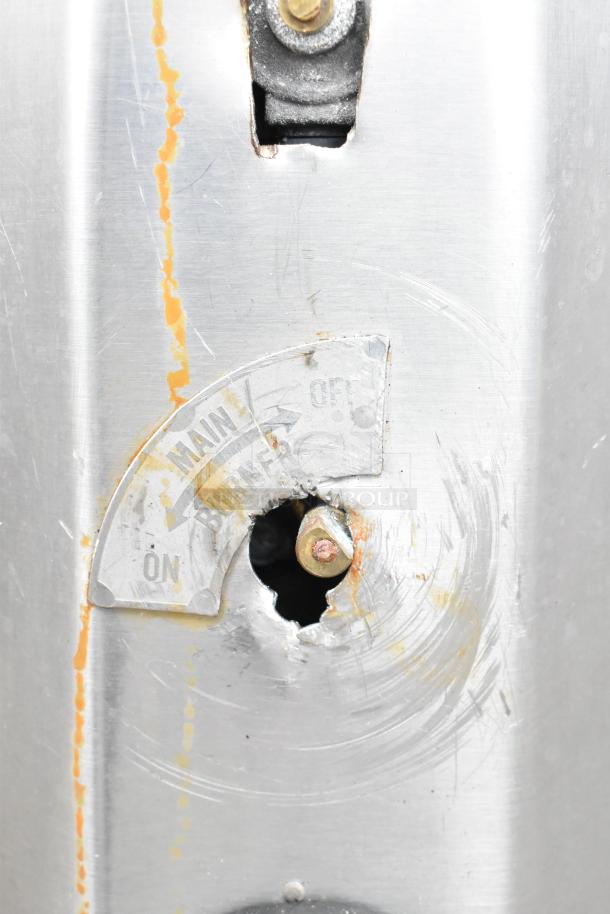 Close-up of a commercial gas-powered single burner pizza oven control panel, showing "MAIN BURNER" with "ON" and "OFF" markings.