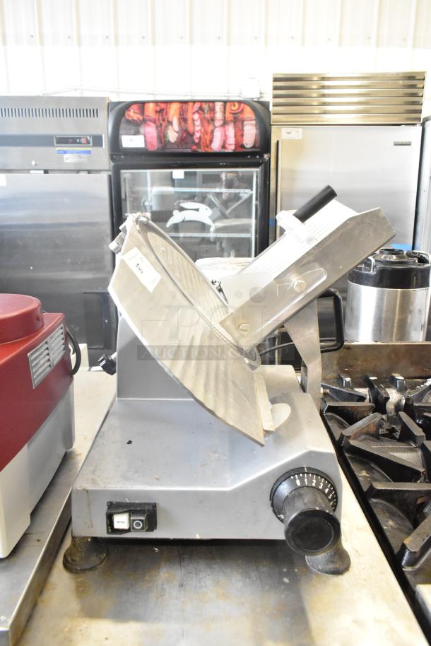 2024 Backyard Pro 551SL112E countertop meat slicer, 115 volts, 1 phase, silver, countertop style, used condition.