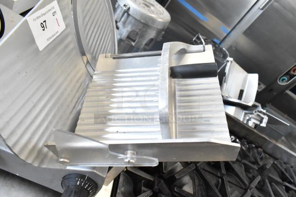 2024 Backyard Pro 551SL112E countertop meat slicer, 115 volts, 1 phase; features adjustable thickness knob and carriage handle.