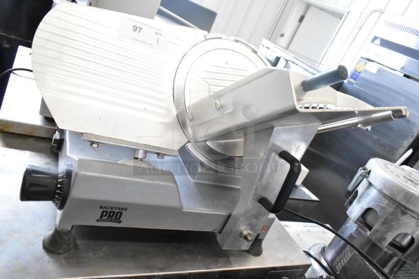 2024 Backyard Pro 551SL112E countertop meat slicer, 115 volts, 1 phase, in good condition. Visible controls and branding.