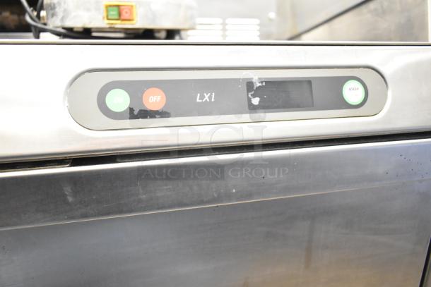 Hobart LXIH undercounter dishwasher, stainless steel, model LXIH. Control panel with on/off and wash buttons. Slight wear visible.