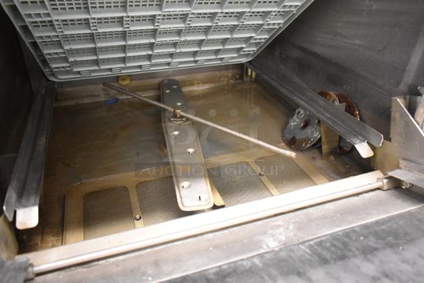 Hobart LXIH Commercial Undercounter Dishwasher interior, showing spray arm and filter, in used condition. Model LXIH.