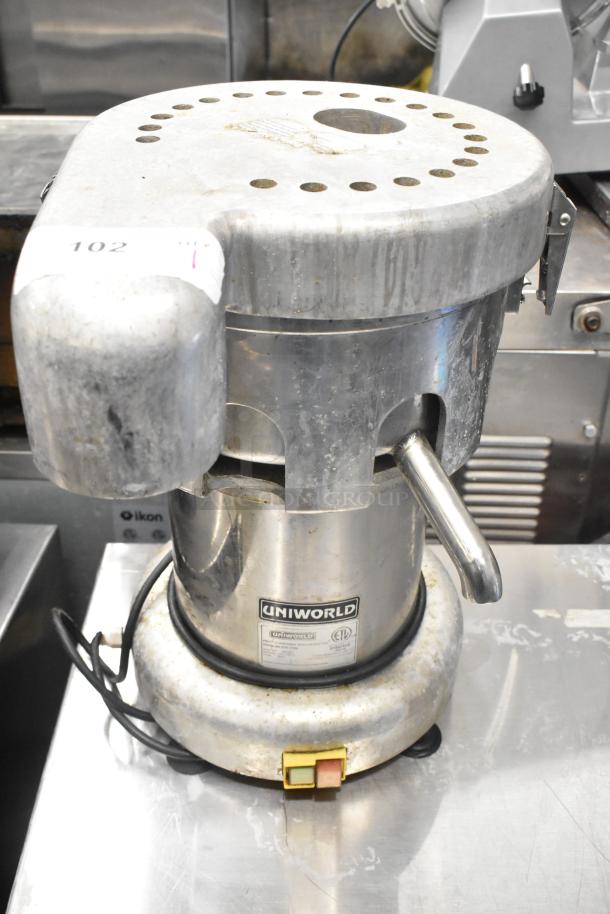 Uniworld UJC-720E commercial juice extractor, stainless steel, 110V, 1 Phase, visible wear, ETL certified, countertop model.