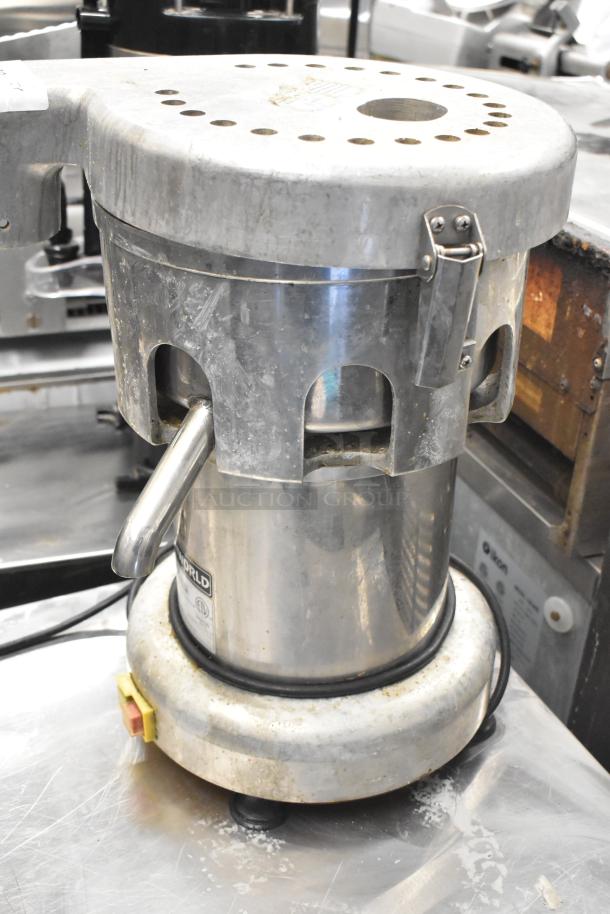 Uniworld UJC-720E commercial juice extractor, stainless steel, countertop model, visible wear, 110V, 1 Phase, label intact.