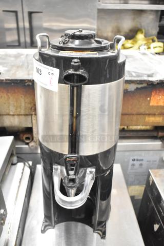 Bunn TF SERVER beverage dispenser, stainless steel and black, with dispensing spout, auction tag visible, good condition.