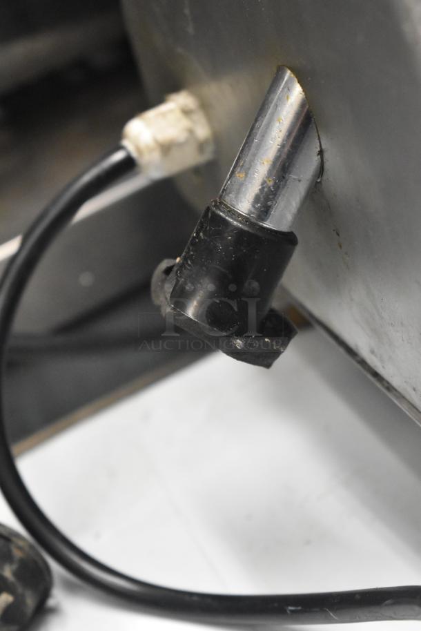 Avantco Commercial Countertop Meat Slicer connector close-up. 115 Volts, 1 Phase, metal body, durable condition.