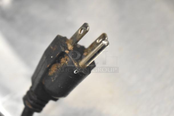 Close-up of a worn power plug for an Avantco Commercial Countertop Meat Slicer. 115 Volts, 1 Phase. Signs of wear visible.