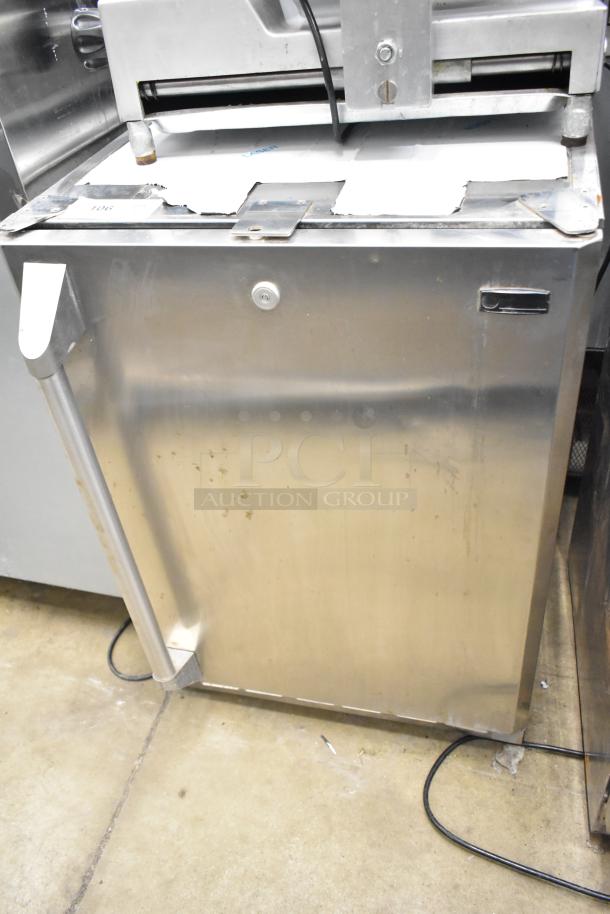 General Electric GE ZDOD240PASS Monogram single door undercounter cooler. Stainless steel, 115 volts, 1 phase, visible wear.