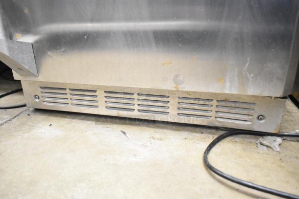 General Electric GE ZDOD240PASS Monogram single door undercounter cooler, metal finish, 115V, 1 Phase, visible wear.